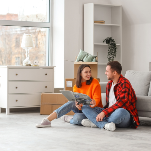 Young couple deciding how to decorate their home on a budget | Swoosh Finance