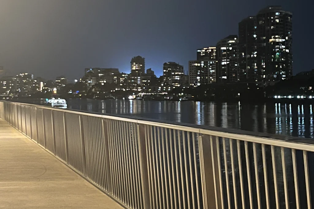 Brisbane Riverwalk at night | Swoosh Finance