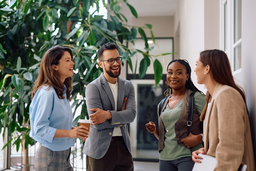 Group of people chatting who all qualify for different centrelink services | Swoosh Finance