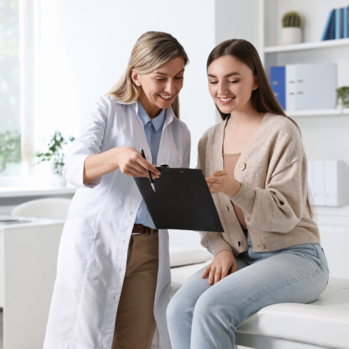 Doctor and Patient looking over medical bill | Swoosh Finance