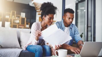 Couple organising their finances after one losing a job | Swoosh Finance