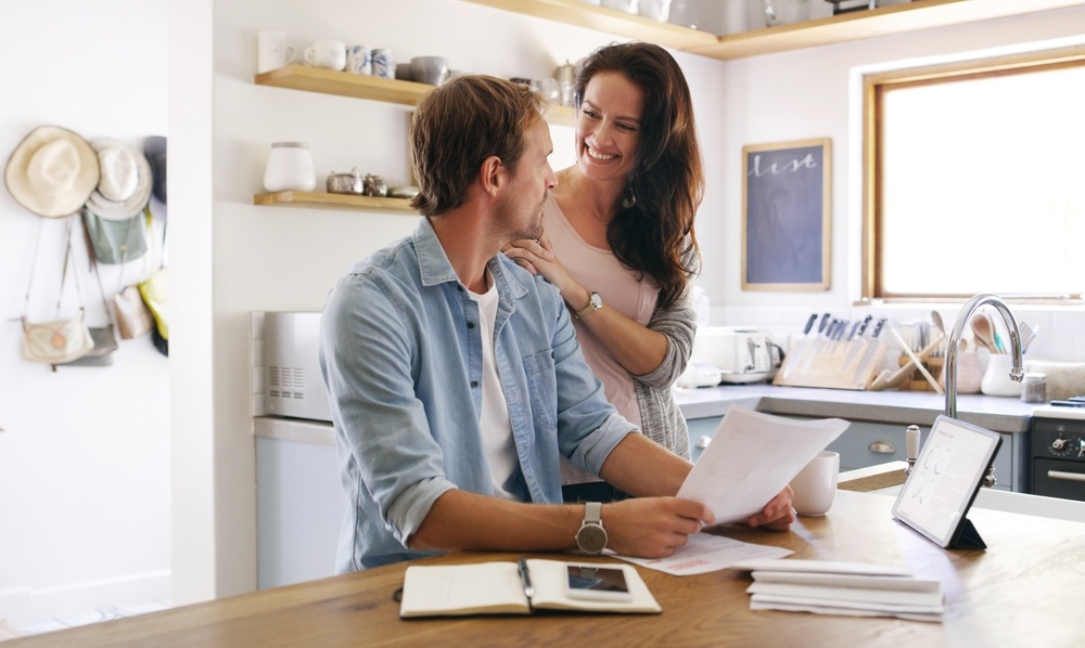 Happy couple getting approved for a loan | Swoosh Finance