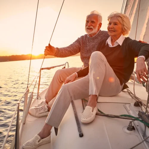 Old couple sight seeing on a boat | Swoosh Finance