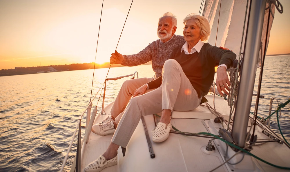 Old couple sight seeing on a boat | Swoosh Finance