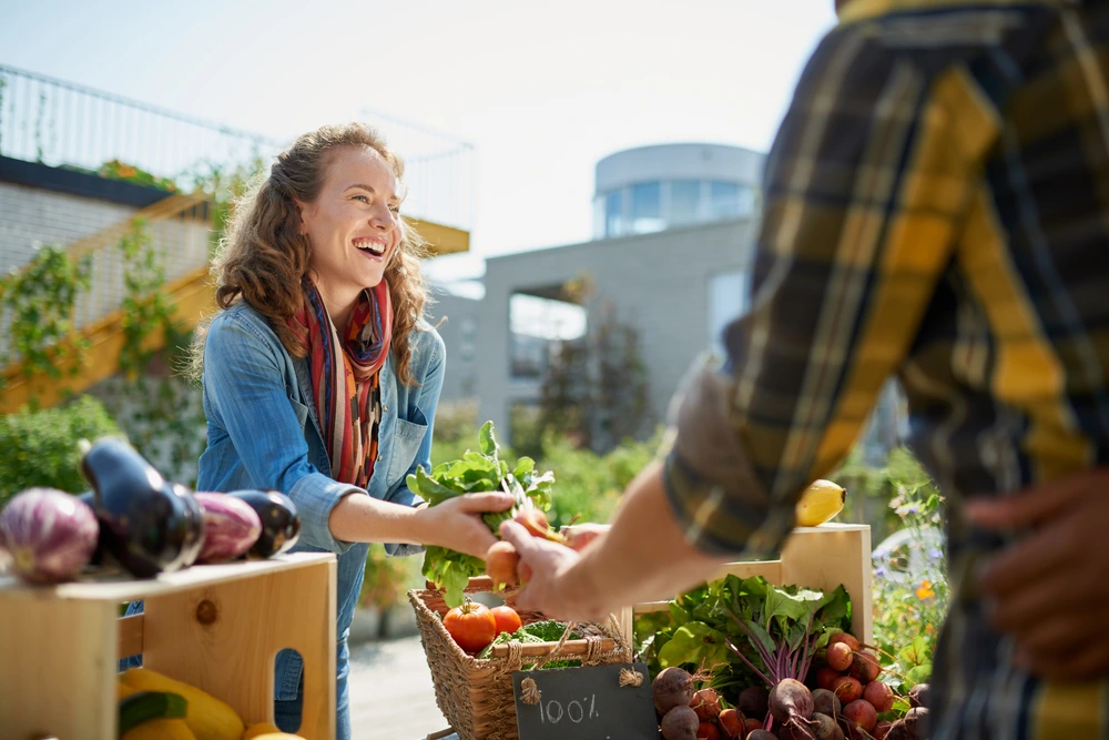 Buying vegetablesa at a local market | Swoosh Finance