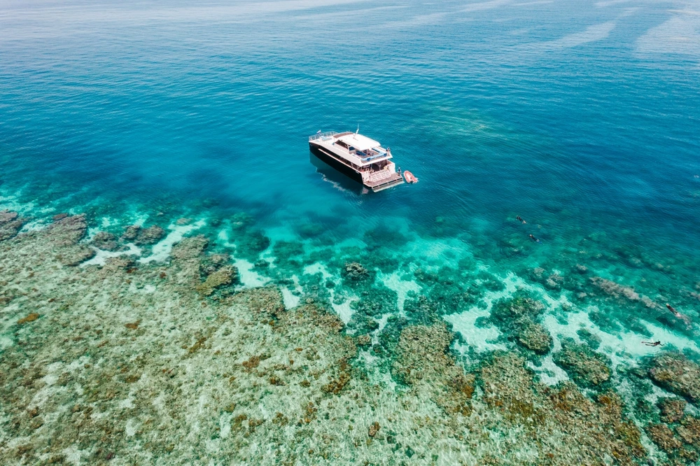 Drone footage over the Great Barrier Reef off the coast of Cairns | Swoosh Finance