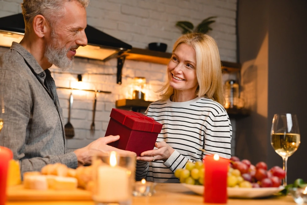 Middle age couple celebrating valentines day | Swoosh Finance