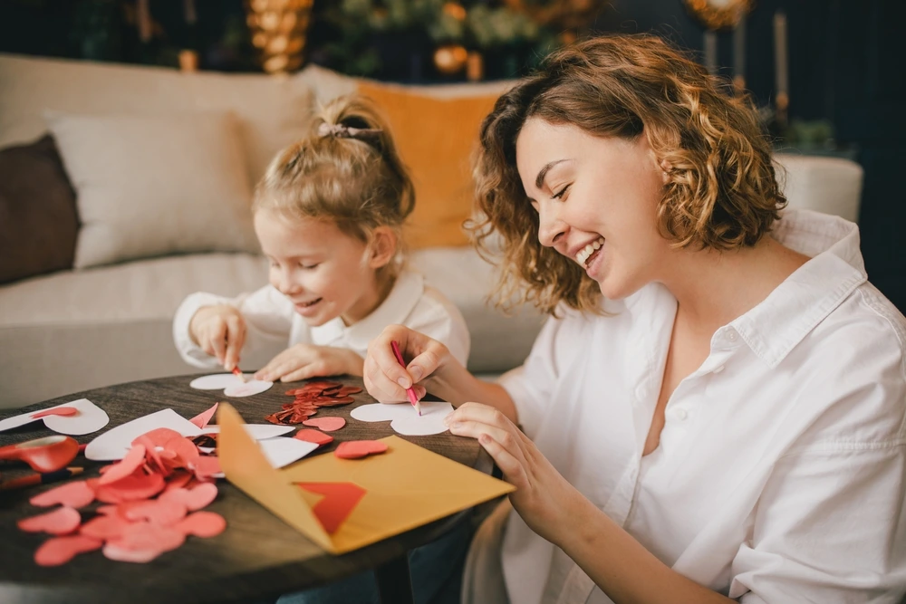 Mum and daughter making Valentine's day cards | Swoosh Finance