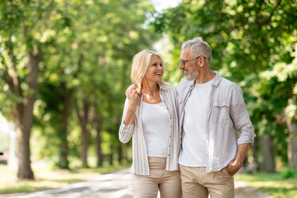 Couple walking in the park | Swoosh Finance