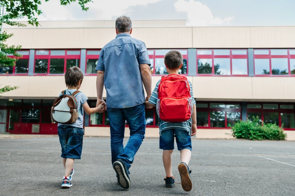 Dad taking his sons to school | Swoosh Finance