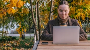 Lady watching her credit score increase | Swoosh Finance